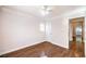 Spare bedroom with hardwood floors, ceiling fan, and closet at 6649 Maple Mesa St, North Las Vegas, NV 89084