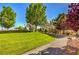 Beautiful community park with walking path, bench, and well-manicured landscaping at 6649 Maple Mesa St, North Las Vegas, NV 89084
