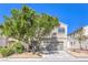 Charming two-story home featuring stucco siding, mature landscaping, and an attached two-car garage at 6649 Maple Mesa St, North Las Vegas, NV 89084