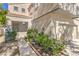 Traditional home showcasing a welcoming entrance, manicured bushes, walkway, and an attached garage at 6649 Maple Mesa St, North Las Vegas, NV 89084