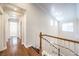 Upstairs hallway features hardwood floors and doorways to rooms at 6649 Maple Mesa St, North Las Vegas, NV 89084