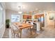 Spacious kitchen and dining area featuring stainless steel appliances and ample counter space for cooking at 6649 Maple Mesa St, North Las Vegas, NV 89084