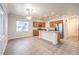 Well-equipped kitchen featuring stainless steel appliances, an island, and ample natural light at 6649 Maple Mesa St, North Las Vegas, NV 89084