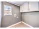 Laundry room with cabinets and a window at 6649 Maple Mesa St, North Las Vegas, NV 89084