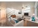 Comfortable living room area with stylish furniture, neutral color, decor, and a staircase at 6649 Maple Mesa St, North Las Vegas, NV 89084