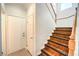 Wooden staircase with white risers leading to the upper level at 6649 Maple Mesa St, North Las Vegas, NV 89084