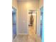 Hallway view of the bathroom with tile flooring and bathtub/shower combo at 73 Hawk Ave, Pahrump, NV 89060