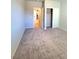 Cozy bedroom featuring neutral walls, carpet, and a closet with sliding doors at 73 Hawk Ave, Pahrump, NV 89060