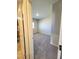 View of a carpeted bedroom from the doorway, painted in neutral tones, creating a peaceful atmosphere at 73 Hawk Ave, Pahrump, NV 89060