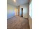 Carpeted bedroom with closet, baseboards, and lots of natural light at 73 Hawk Ave, Pahrump, NV 89060