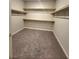 Spacious walk-in closet with multiple shelves, offering ample storage space at 73 Hawk Ave, Pahrump, NV 89060