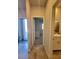 Hallway view of a bedroom and a bathroom with white cabinets at 73 Hawk Ave, Pahrump, NV 89060
