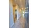 Hallway with tile floors, a view of the interior, and white trim at 73 Hawk Ave, Pahrump, NV 89060