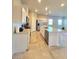 Bright kitchen featuring white cabinetry, stainless steel appliances, and a large center island with granite countertops at 73 Hawk Ave, Pahrump, NV 89060
