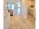 Modern kitchen and laundry area combination with appliances and tiled floors at 73 Hawk Ave, Pahrump, NV 89060