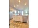 Kitchen island with stainless steel appliances, granite countertops, and ample cabinet space at 73 Hawk Ave, Pahrump, NV 89060