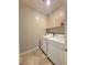 Bright laundry room features tile flooring and a modern washer and dryer at 73 Hawk Ave, Pahrump, NV 89060