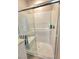 Modern bathroom with white subway tile shower, bench, and glass door at 73 Hawk Ave, Pahrump, NV 89060