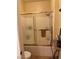 Bathroom with a shower-tub combination, tiled walls, and modern fixtures at 7400 W Flamingo Rd # 1090, Las Vegas, NV 89147