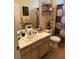 Bathroom featuring tile floors, framed mirror, and decorative shelving at 7400 W Flamingo Rd # 1090, Las Vegas, NV 89147