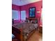 Bedroom with wood floors and two sunny windows at 7400 W Flamingo Rd # 1090, Las Vegas, NV 89147