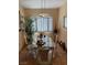 Well-lit dining room with a glass top table, comfortable seating, and large windows at 7400 W Flamingo Rd # 1090, Las Vegas, NV 89147