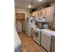 Functional kitchen featuring white appliances and adjoining laundry area for added convenience at 7400 W Flamingo Rd # 1090, Las Vegas, NV 89147