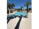 Community swimming pool, blue water, lounge chairs, clear blue sky at 7400 W Flamingo Rd # 1090, Las Vegas, NV 89147