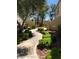 Exterior walkway with green bushes at 7400 W Flamingo Rd # 1090, Las Vegas, NV 89147