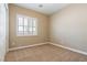 Cozy bedroom with carpet, shutters, and a closet at 7434 Eggshell Dr, North Las Vegas, NV 89084