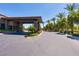 Clubhouse entrance with well-manicured landscaping, convenient parking, and modern architecture at 7434 Eggshell Dr, North Las Vegas, NV 89084