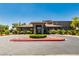 Elegant community clubhouse with meticulous landscaping in a circular drive at 7434 Eggshell Dr, North Las Vegas, NV 89084