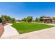 Expansive green common area next to the gazebo and community pool at 7434 Eggshell Dr, North Las Vegas, NV 89084