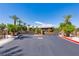 Gated community entrance with stone pillars, mature landscaping, and a secure entryway at 7434 Eggshell Dr, North Las Vegas, NV 89084