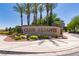 Community sign, 'Club Aliante', surrounded by lush landscaping and mature palm trees at 7434 Eggshell Dr, North Las Vegas, NV 89084