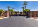 Gated entrance to the community, with stone pillars and well-maintained landscaping at 7434 Eggshell Dr, North Las Vegas, NV 89084