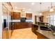 Gourmet kitchen with stainless steel appliances, granite countertops, and custom dark wood cabinets at 7434 Eggshell Dr, North Las Vegas, NV 89084