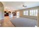 An open living area features tile and carpet floors with views of a gourmet kitchen space at 7434 Eggshell Dr, North Las Vegas, NV 89084
