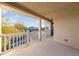 Cozy covered balcony offering neighborhood views, decorative railings, and ample outdoor space at 7438 Desertscape Ave, Las Vegas, NV 89178