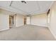 Empty bedroom featuring a trey ceiling, carpet and access to a bathroom at 7438 Desertscape Ave, Las Vegas, NV 89178