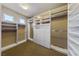 Walk-in closet with custom built-in shelving and drawers, offering ample storage space at 7438 Desertscape Ave, Las Vegas, NV 89178