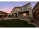 Multi-level house featuring a balcony and a well maintained backyard with an outdoor patio at 7438 Desertscape Ave, Las Vegas, NV 89178