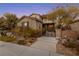 Charming two-story home featuring a cozy front yard and a private courtyard at 7438 Desertscape Ave, Las Vegas, NV 89178