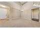 Spacious living room featuring a high ceiling and elegant chandelier at 7438 Desertscape Ave, Las Vegas, NV 89178