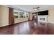 Spacious living room features hardwood floors, fireplace, and large windows at 7438 Desertscape Ave, Las Vegas, NV 89178