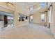 Bright, open living room with high ceilings and neutral carpet at 7438 Desertscape Ave, Las Vegas, NV 89178