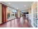 Open living space leading to the patio with hardwood floors and natural light at 7438 Desertscape Ave, Las Vegas, NV 89178