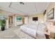 Staged bedroom featuring a king bed, contemporary decor, and ample natural light at 7438 Desertscape Ave, Las Vegas, NV 89178
