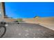 Expansive backyard featuring gravel ground cover, block wall fencing, and space for outdoor activities at 76 Summer Rhapsody Ave, Henderson, NV 89015
