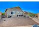 Spacious backyard with gravel landscaping, complete with seating areas and surrounded by a secure fence at 76 Summer Rhapsody Ave, Henderson, NV 89015